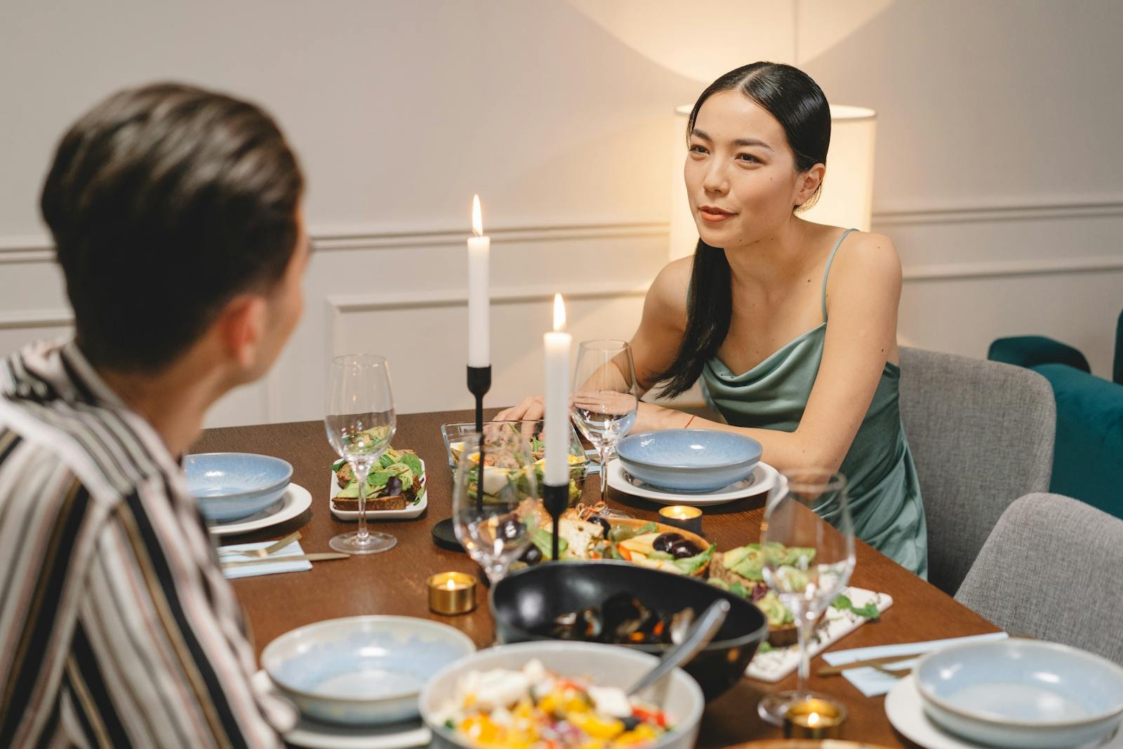 Romantic dinner for two with candlelit ambiance and gourmet dining experience indoors.