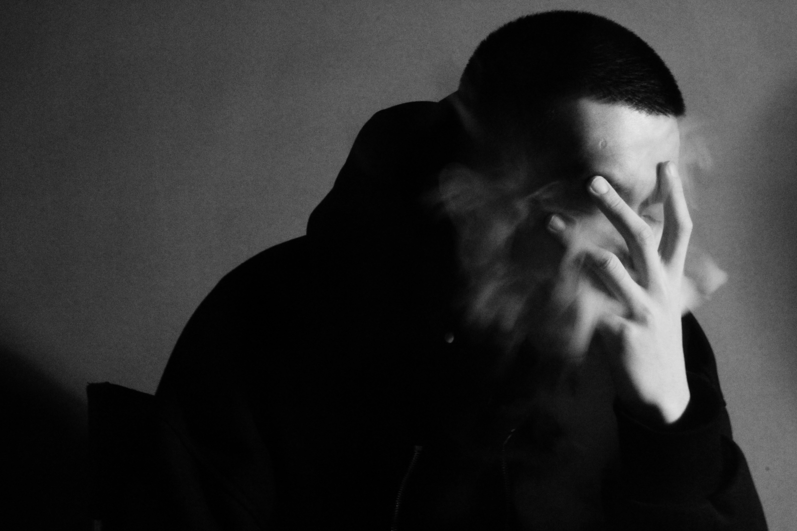 Photo by fire_Baobao 1 Dramatic black and white photo of a man obscured by smoke with a moody, introspective feel.